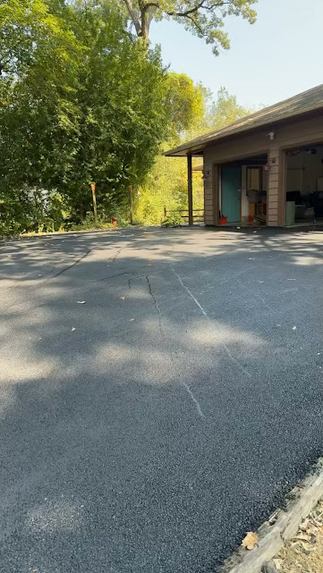 Residential asphalt driveway evaluated for replacement in Northern Illinois