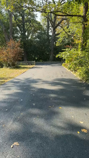 Finished long asphalt driveway by The Blacktop Guy
