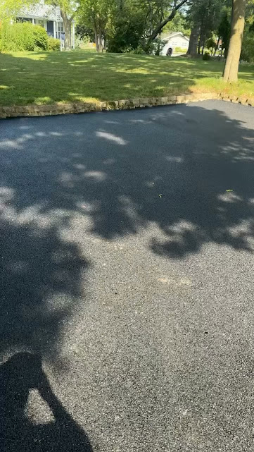 Finished residential blacktop driveway by The Blacktop Guy